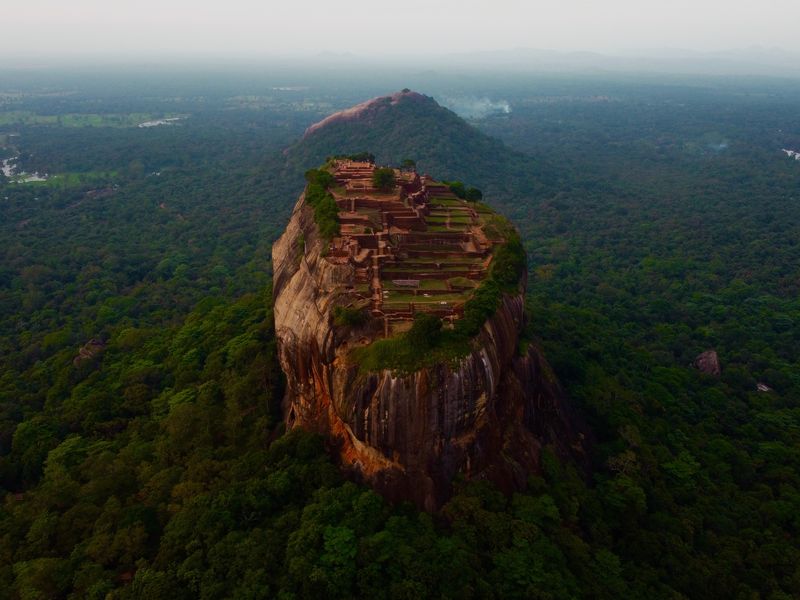Sigiriya is one of the best of Sri Lanka's historical places. This image shows an aerial view of the rock and the complex ruins at the summit.