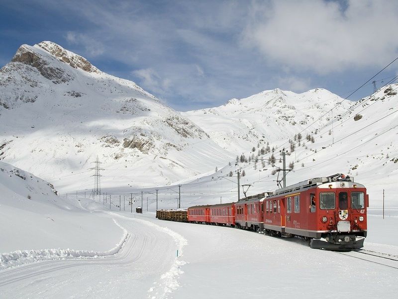 Rochers de Naye is a good option of the mountains close to Geneva. This image shows a red train making its way up the snowy mountain.