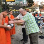 Alms and Wat Phra That Doi Suthep Private Chiang Mai Tour - Starting Early with a Private Pickup