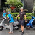 Saigon Morning and Afternoon Adventure by Vespa - First Stop: Riverside Sunrise & City Views