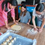 Volunteer program with children and women - The Sum Up
