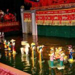 3-hour Dinner cruise on Saigon river plus Cyclo & Water puppet show evening - Discovering the Water Puppet Show at Golden Dragon Theater