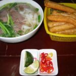 Small Group Hanoi Evening Tour with Cyclo and Water Puppet Show with Food - Culinary Finish: Beef Noodles and Vegetarian Options
