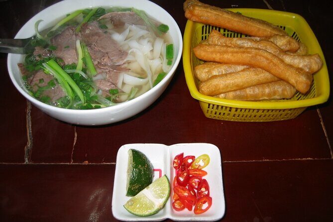 Small Group Hanoi Evening Tour with Cyclo and Water Puppet Show with Food - Culinary Finish: Beef Noodles and Vegetarian Options