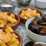 Seafood paella cooking class, tapas and visit to Ruzafa market. - Guides and Execution