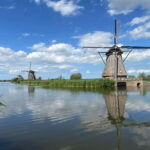 Amsterdam: Kinderdijk, Euromast, Delft and Den Haag Day Tour - Detailed Tour Breakdown