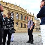Best of Prague: Private City Walking Tour, Boat Cruise, and Typical Czech Lunch - Crossing Charles Bridge
