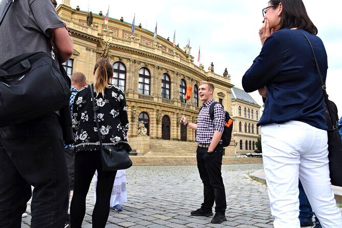 Best of Prague: Private City Walking Tour, Boat Cruise, and Typical Czech Lunch - Crossing Charles Bridge