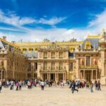 From Paris: Versailles Palace & Gardens with Transportation - Arriving at Versailles: Imposing Architecture and Historic Gates