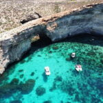 From Sliema: Comino, Crystal Lagoon, and Blue Lagoon Cruise - Blue Lagoon: The Highlight and Its Challenges