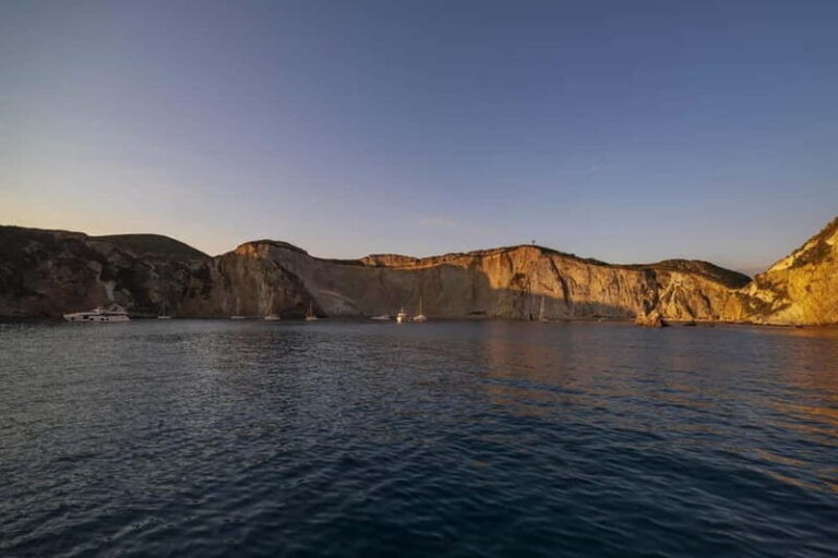 Ponza: Sunset by boat with aperitif and swim at Chiaia di Luna - The Sum Up