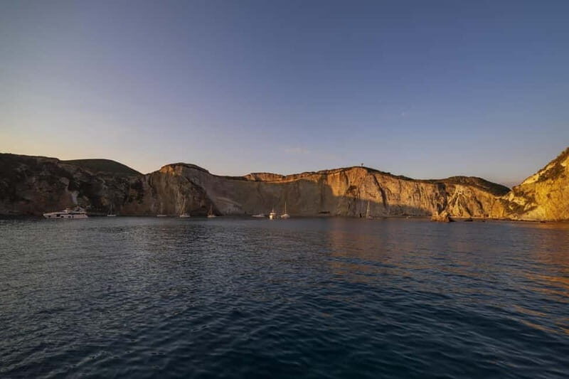 Ponza: Sunset by boat with aperitif and swim at Chiaia di Luna - The Sum Up