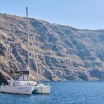 Santorini: Caldera Luxury Catamaran Cruise with Meal & Drinks - Starting Point and Overall Atmosphere