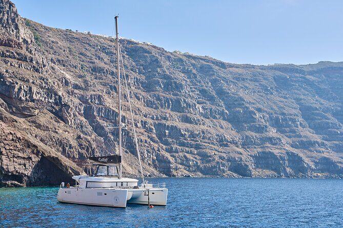 Santorini: Caldera Luxury Catamaran Cruise with Meal & Drinks - Starting Point and Overall Atmosphere