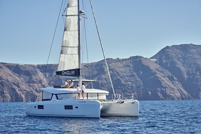 Santorini Oia: Private Sunset Catamaran Cruise with BBQ & Drinks - Food & Drinks: A Feast at Sea