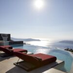 Daybed Relaxation with infinity pool use with caldera views - Who Should Consider This Experience?
