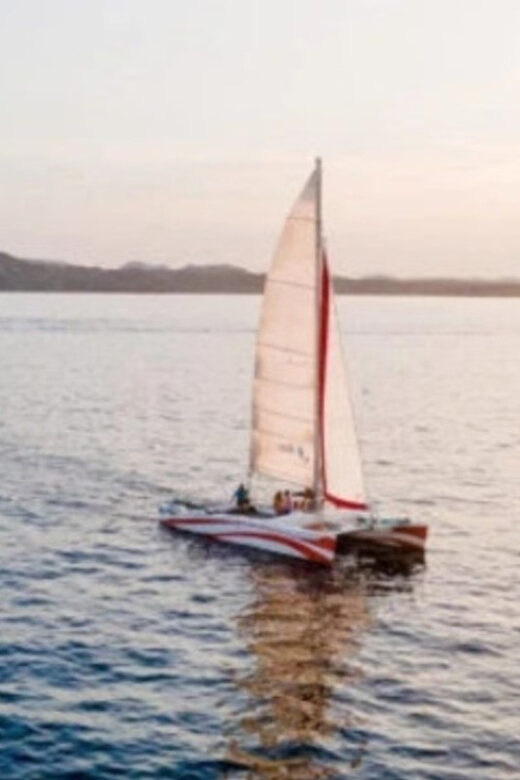 Fornells: Catamaran Sunset Cruise of Menorca's Coast - The Sum Up