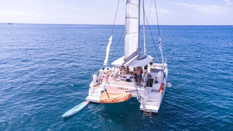 Gran Canaria: Catamaran tour with lunch along unspoiled beaches - Authentic Experiences and Practical Details