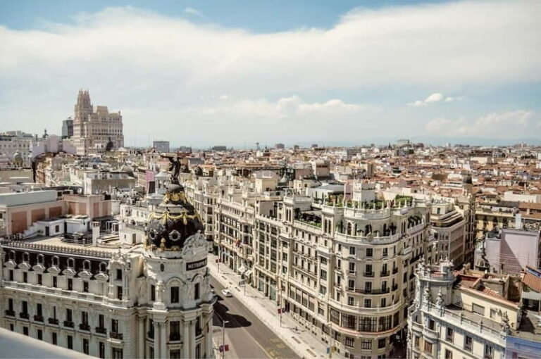 Madrid: Private Highlights Walking Tour with Rooftop Stop - Discovering Landmark Highlights