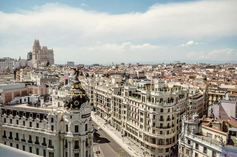 Madrid: Private Highlights Walking Tour with Rooftop Stop - Discovering Landmark Highlights