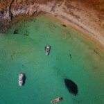 Mykonos: Delos and Rhenia Land Cruise with Fruit and Snacks - Delos: The Mythological and Archaeological Gem