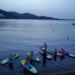 Paddle Surf with Led lights at sunset in Menorca - What to Expect from the Sunset Paddle Experience