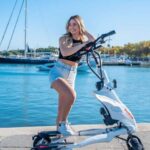 Rhodes: Explore the New and Medieval City on Trikkes - Riding Through Mandraki Harbor