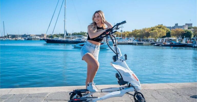 Rhodes: Explore the New and Medieval City on Trikkes - Riding Through Mandraki Harbor