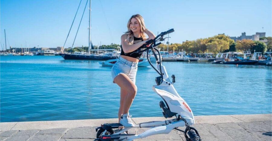 Rhodes: Explore the New and Medieval City on Trikkes - Riding Through Mandraki Harbor