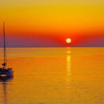 Rhodes: Sunset Catamaran Cruise with Dinner, Drinks & Swim - An Authentic and Scenic Experience on Rhodes