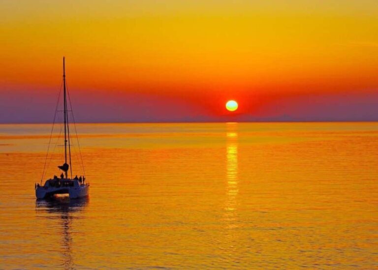 Rhodes: Sunset Catamaran Cruise with Dinner, Drinks & Swim - An Authentic and Scenic Experience on Rhodes