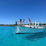 Traditional boat 10 beaches in the south of Menorca. Snorkeling, SUP and drinks - What to Expect from the Experience