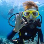 Baptism diving in the turquoise waters of Tahiti - Why This Tour Works Well
